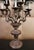 An exceptional and rare pair of vintage Italian mid-century candelabra table lamps heavily styled in the opulent Hollywood...