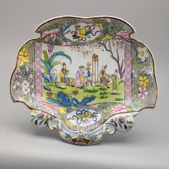A richly patterned and decorative pair of ironstone Chinoiserie dishes. A pair of Ironstone printed shell shaped dessert...