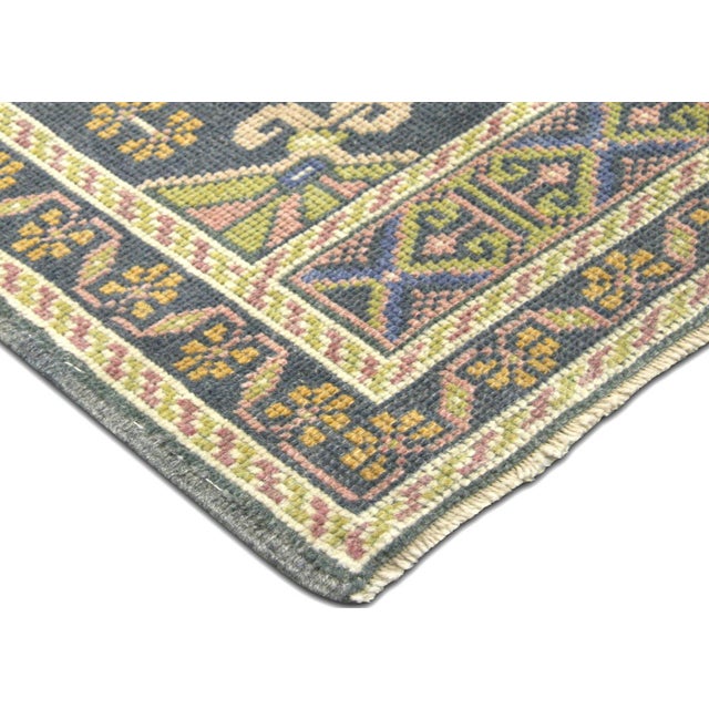 This Vintage Turkish Oushak Yastic boasts a hand woven construction of wool on a wool foundation, crafted in the Oushak...