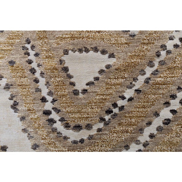 This modern half-pile rug offers a refined take on abstract design, blending sculptural patterning with a subtle, tactile...