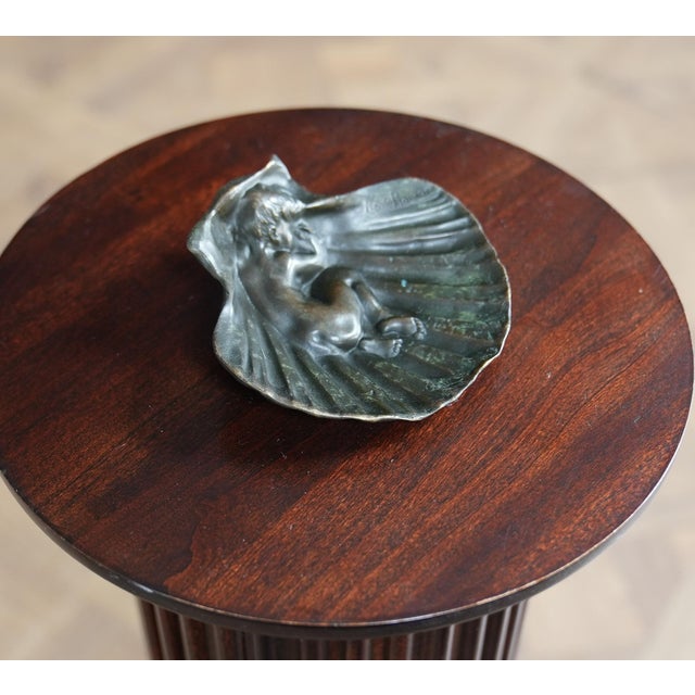 Meticulously hand crafted this lovely figure of a Child Sleeping in Clamshell Bronze makes for a striking display piece....