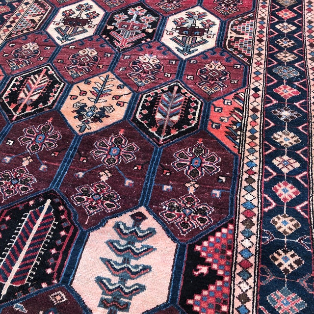 A beautiful antique rug that brings warmth, character, and timeless appeal to any space. Handwoven approximately 80 years...