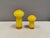 Two Holmegaard ‘Palet’ mushroom-shaped salt and pepper shakers by Michael Bang in yellow. An example of Danish mid-century...