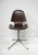A sculptural molded dark walnut Hourglass swiveling desk chair with sturdy metal four star base and foot pads . A rare...