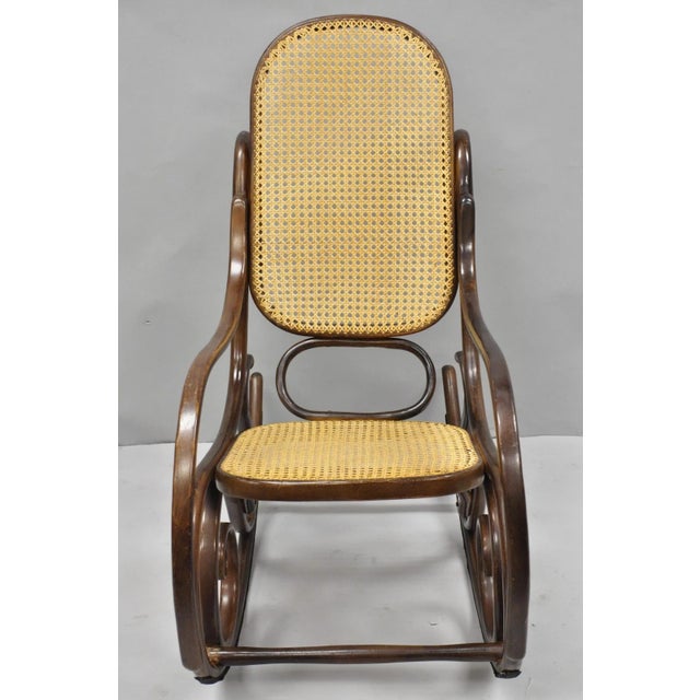 Vintage Mid Century Modern Thonet Style Bentwood & Cane Rocker Rocking Chair (A). Circa Mid 20th Century. Measurements:...