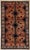 Antique hand-knotted rug from the Shiraz region of southern Iran, featuring a warm camel-brown field with a bold,...