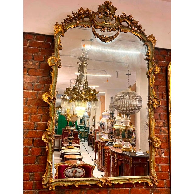 Add a dramatic European touch to your interior with this ornate French Rococo-style wall mirror, distinguished by its...