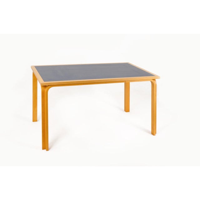 Danish table, designed by Thygesen and Sorensen for Magnus Olesen, 1970s. Model DK 7870, rectangular, with curved solid...