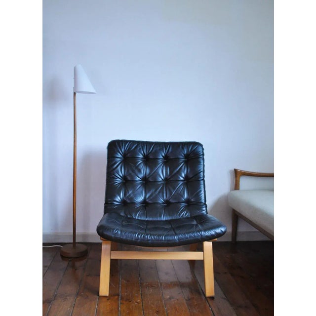 Black leather lounge chair by farstrup møbler. Leather upholstery in a fine condition. Frame in laminated beech. good...