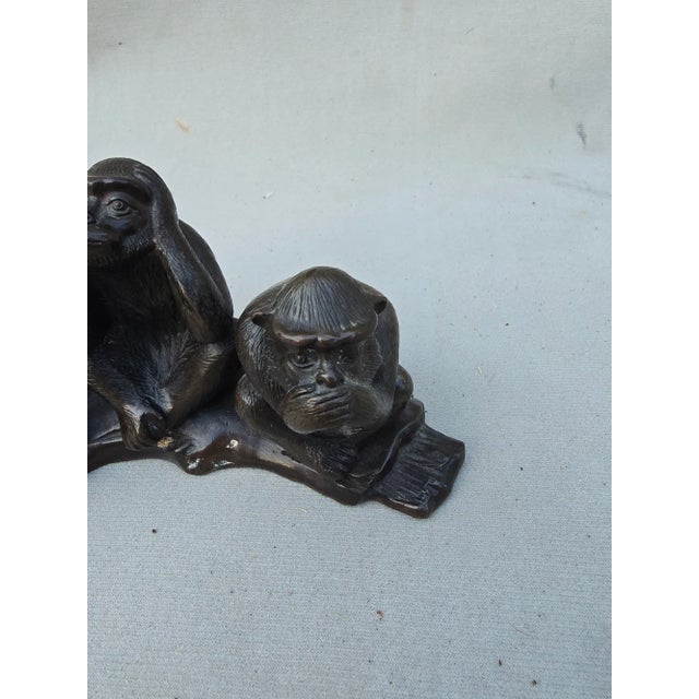This is a bronze statue of the Three Wise Monkeys. Representing, see no evil, hear no evil and speak no evil.