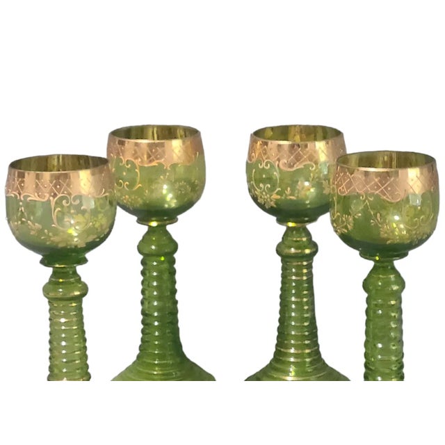 Antique Bohemian Moser Chalices Green Gilded Roemer Stem Set Of 4. Good condition minor flea bite chips on one bottom stem...