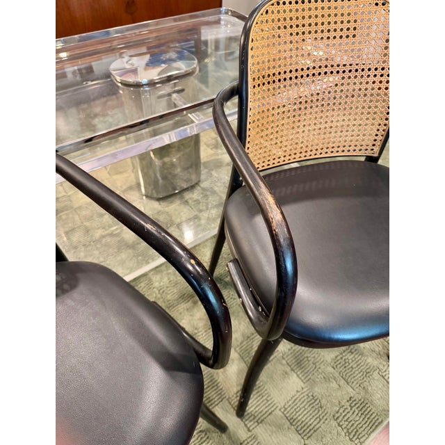 A pair of rare vintage black and tan bentwood thonet chairs by Josef Hoffman for Ligna, circa 1970s. Ligna was the former...