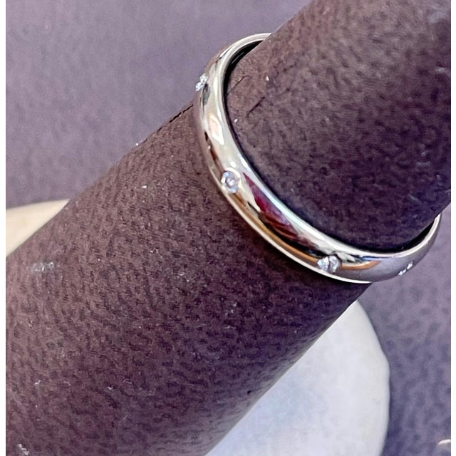 8 Flush Set Bezel Diamond Eternity Wedding Band in 14 Karat White Gold Size 7 Very clean and shiny diamonds. Approximately...