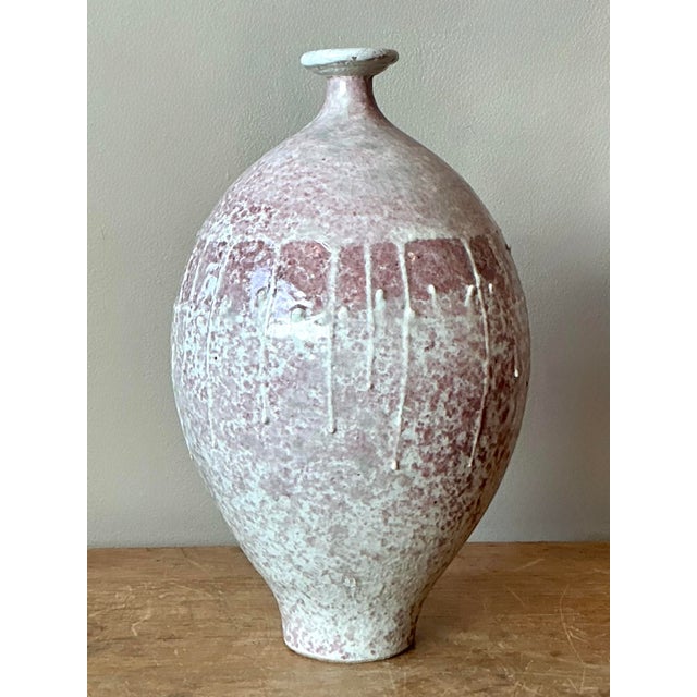 Introduce a touch of organic warmth and artisanal texture to your home with this captivating vintage studio pottery vase....