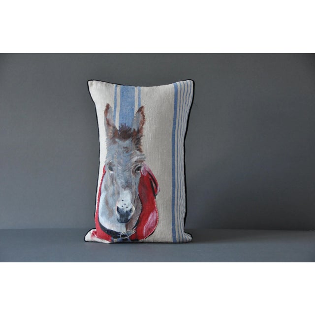 The Asino cushion is part of the Animalium collection by GAIADIPAOLA. It's hand painted and embroidered on vintage fabric....