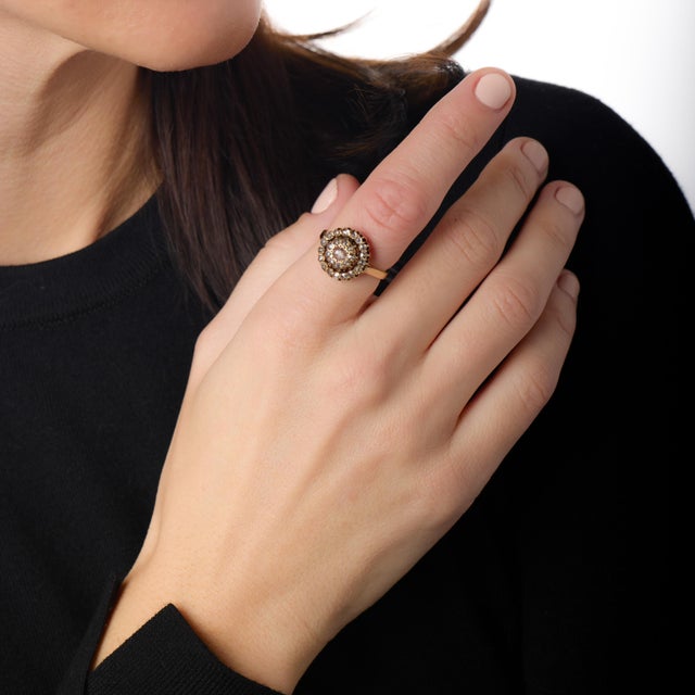 This enchanting Victorian halo ring is a beautiful expression of turn-of-the-century romance and antique craftsmanship....