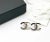 This is part of Chairish’s Costume Jewelry assortment. Chanel Brand New Gold Gunmetal CC Half Half Large Piercing Earrings...