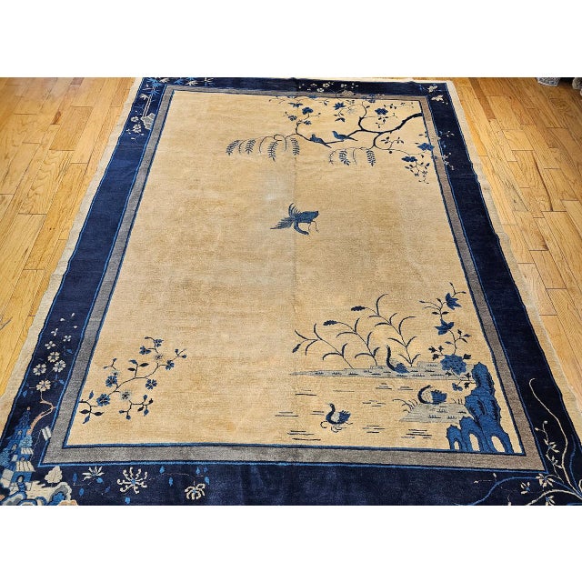 This early 20th century Art Deco Chinese rug is a meditation in landscape — a room-size textile that evokes the vast,...
