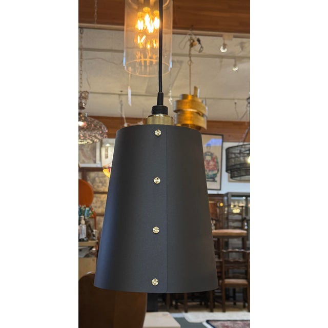Design Plus Gallery presents a Buster & Punch pendant. A ceiling light made from solid metal with matte rubber detailing....