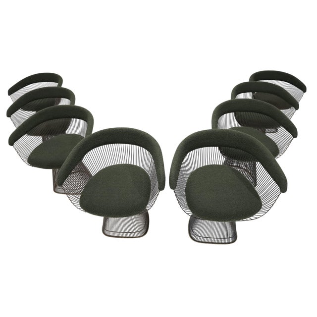 We have newly reupholstered this set of eight Warren Platner Bronze Frame dining chairs in a quality dark green boucle'....