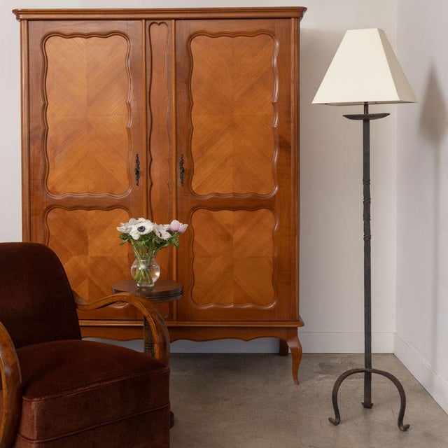 Lovely vintage wrought iron brutalist floor lamp from France, 1940s. Heavy iron stem with three curved iron legs. New...