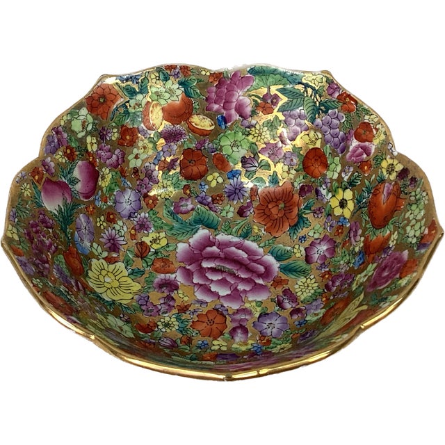Bright colorful Chinese hand painted floral bowl with scalloped edges. Gilding on rim and throughout bowl. Signature mark...