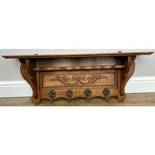 This elegant Vintage French coat hanger showcases beautifully carved detailing and a warm, rich wood finish, making it...