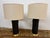 Design Plus Gallery presents a Pair of Navy Ceramic and Brass Table Lamps from Pottery Barn. The lamps have a rounded...