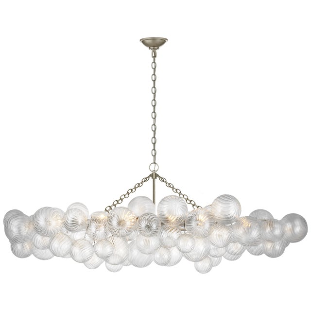 Talia Large Linear Chandelier in Burnished Silver Leaf with Clear Swirled Glass Designer: Julie Neill Canopy: 6" Round...