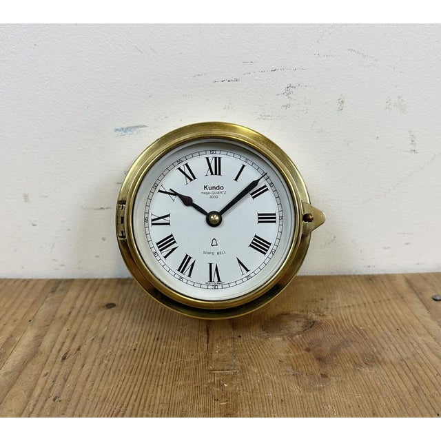 Vintage ship clock made by Kundo in West Germany during the 1970s.It features a brass body frame and clear glass cover....