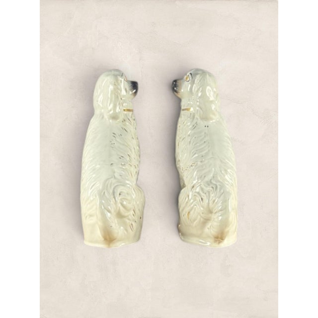 Antique English Ceramic Staffordshire Mantle Dogs. In Scotland, these ceramic spaniels were known as "Wally Dugs," and for...