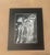 An evocative black-and-white botanical artwork depicting a delicate stand of tall, stylized botanicals. The luminous white...