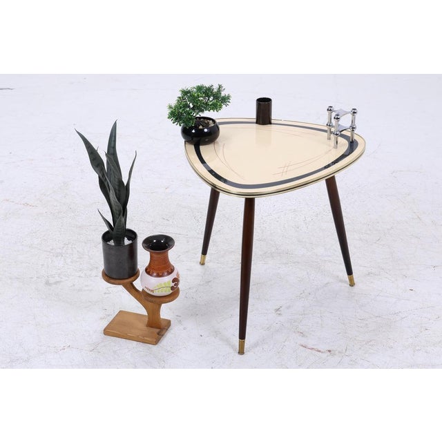 Vintage side table from the 60s FEATURES * High-quality workmanship * Vintage design * Material: Wood & glass * Gold trim...