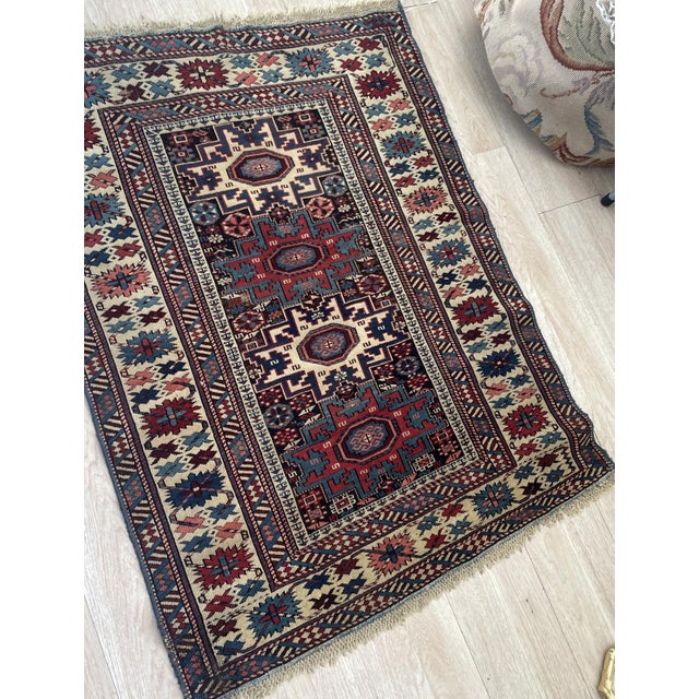 A striking and rare example of late 19th-century Caucasian weaving, this antique Lezgi rug features the iconic, sharp-...