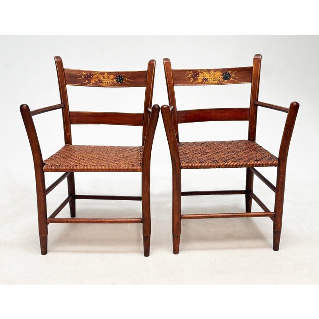 An exceptional and highly decorative set of four American Folk Art armchairs dating to the first half of the 20th century,...
