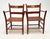An exceptional and highly decorative set of four American Folk Art armchairs dating to the first half of the 20th century,...