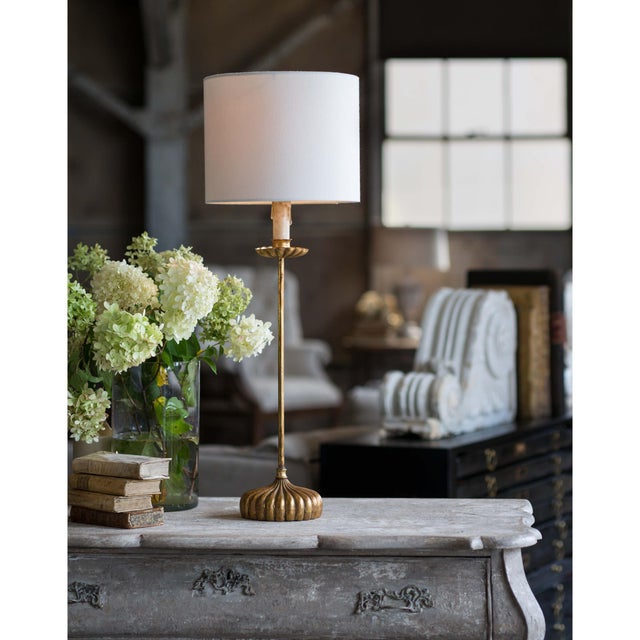 Add a touch of elegant style to your home with the Clove Stem Buffet Lamp. With a dramatic base finished in antiqued gold,...