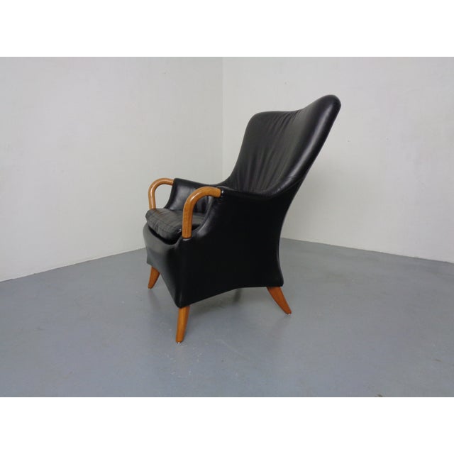 Danish leather armchair with slightly flared legs by Søren Nissen & Ebbe Gehl for Jeki & Nielhaus from the 1980s. This...