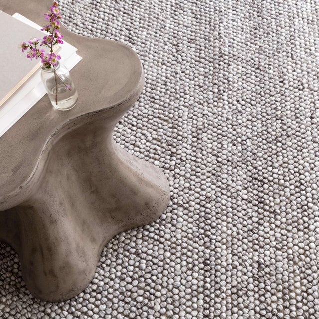 The pebbled texture, appealing to the eye as well as underfoot, is a sophisticated foundation for your favorite low-...