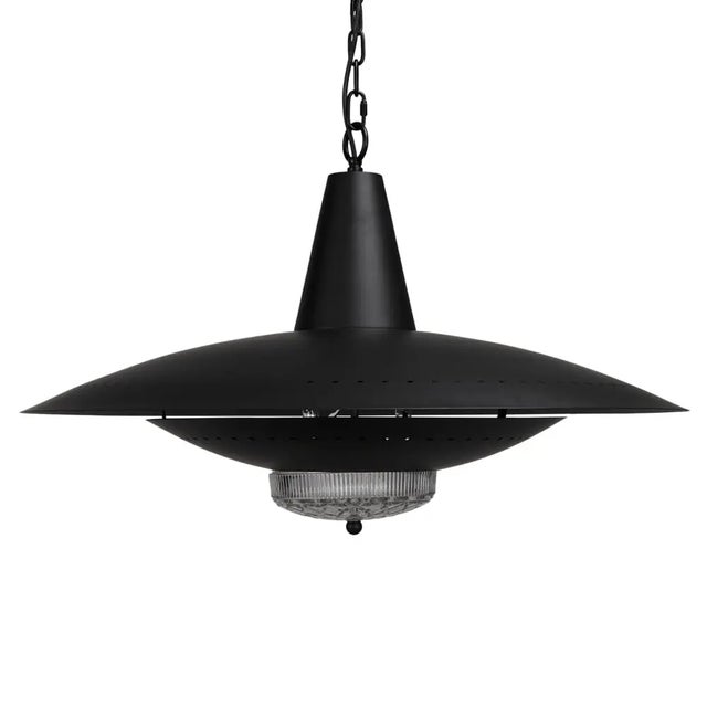 The UFO Pendant is an eye-catching lighting fixture that complements a variety of interior styles, from industrial to modern.