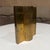 For your consideration, a mid-century modern sculptural object, likely a brass bookend or decorative sculpture vase...