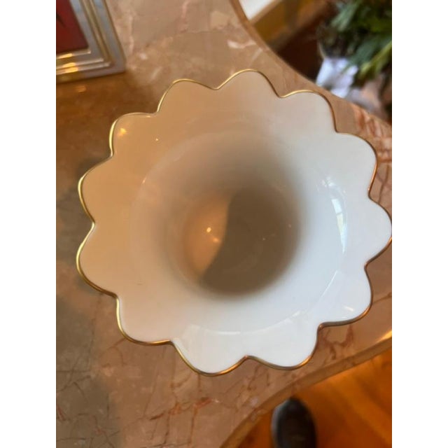 This exquisite piece is a signature Herend porcelain vase featuring intricate, hand-painted floral motifs and a delicate...
