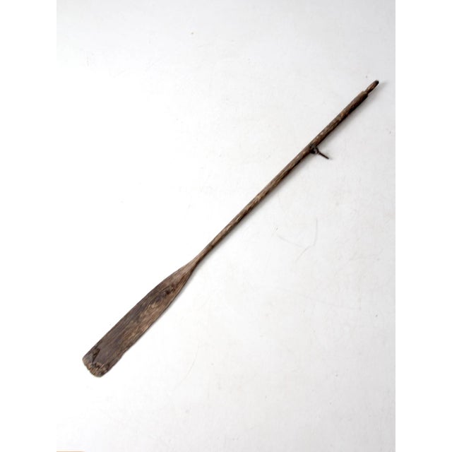 This vintage wooden oar features natural aging and weathered wood tones that give it a classic, timeworn look. A versatile...