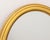 Modern Giltwood Framed Oval Mirror, J. Pocker & Son label to reverse. Mirror plate: 19.25" H x 15.25" W; frame: 24" H x...