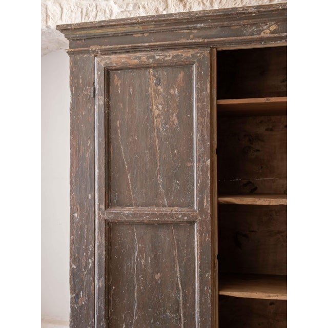 A magnificent poplar cabinet reclaimed in Tuscany. Dating to the 18th century, it features two masterfully paneled doors....