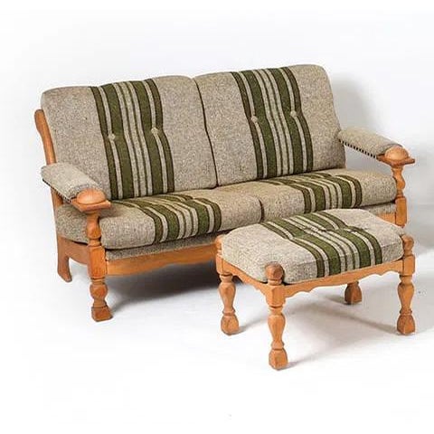 A Danish modern loveseat with a great oak frame and striped upholstered cushions. Arms have an "orb" type detail which...