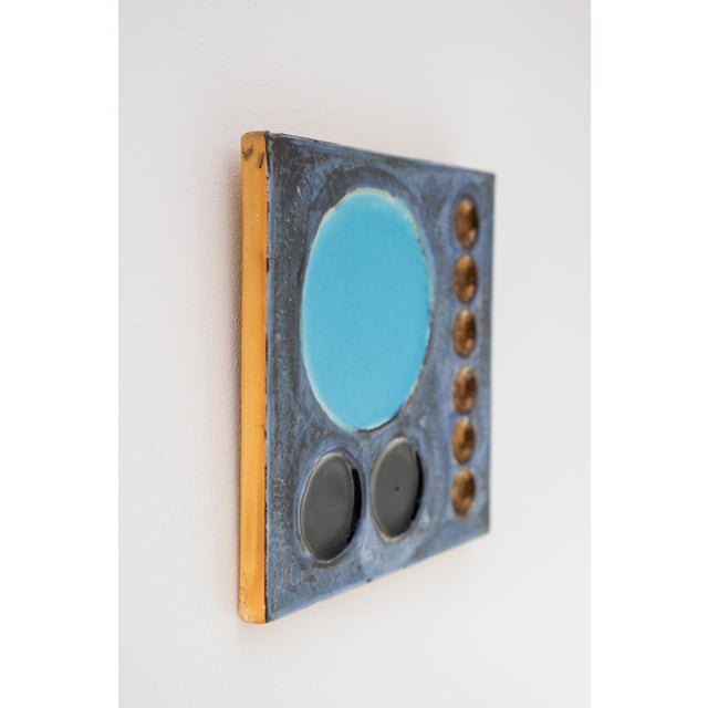 A ceramic wall plaque titled “Kavalkad” designed by Olle Alberius for Rörstrand 1970s. This striking piece exemplifies...