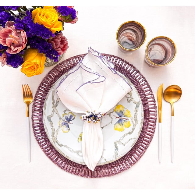 Bring a touch of elegance and sophistication to your dining experience with our Linen Napkins with Purple Ruffled...