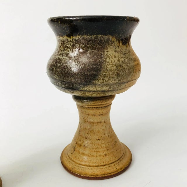 A set of 2 vintage studio pottery goblets. Beautiful layered glazes in natural colors. Signed on the bases.