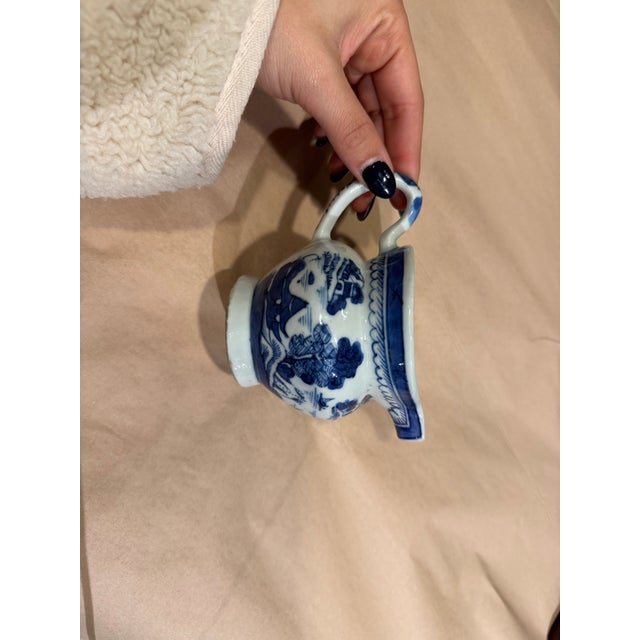 This is a 19th century blue and white canton teacup.